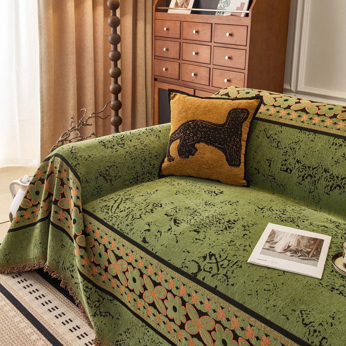 Olive Green Luxe Heritage sofa throw draped over a three-seater sofa in a bright living room, view 3