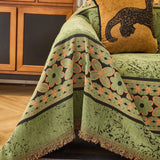 Olive Green Luxe Heritage sofa throw seen from the side on a corner sofa, view 3