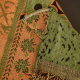 Olive Green Luxe Heritage sofa throw spread across a sofa in daylight, view 3
