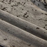Pearl Grey Luxe Heritage sofa throw photographed at an angle beside a floor lamp
