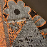 Pearl Grey Luxe Heritage sofa throw spread across a sofa in daylight