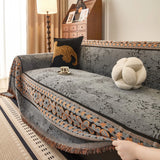 Pearl Grey Luxe Heritage sofa throw shown on a straight sofa against a pale wall