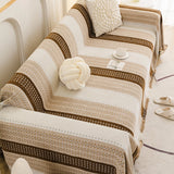 Auburn Brown Metro Stripe sofa throw shown across the seat and backrest of a two-seater