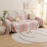 Blush Pink Metro Stripe sofa throw draped over a three-seater sofa in a bright living room, view 3