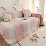 Blush Pink Metro Stripe sofa throw seen from the side on a corner sofa, view 3
