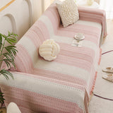 Blush Pink Metro Stripe sofa throw shown across the seat and backrest of a two-seater, view 3