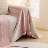 Blush Pink Metro Stripe sofa throw covering the arm and seat of a sectional, view 3