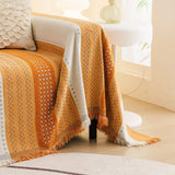 Orange Arrow Metro Stripe sofa throw covering the arm and seat of a sectional, view 4