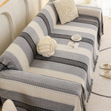 Pearl Grey Metro Stripe sofa throw shown across the seat and backrest of a two-seater, view 2