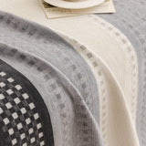 Pearl Grey Metro Stripe sofa throw styled with cushions on a low-back sofa, view 2