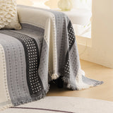 Pearl Grey Metro Stripe sofa throw covering the arm and seat of a sectional, view 2
