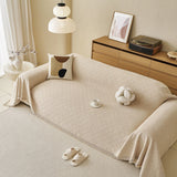Ivory Cream Relief Weave sofa throw draped over a three-seater sofa in a bright living room