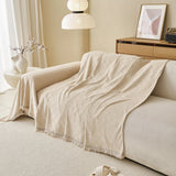 Ivory Cream Relief Weave sofa throw shown across the seat and backrest of a two-seater
