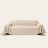 Ivory Cream Relief Weave sofa throw on a plain studio background