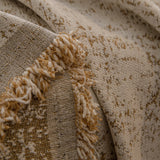 Boucle-Style Sand Spotted sofa throw shown across the seat and backrest of a two-seater