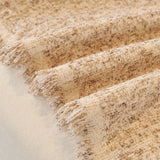 Warm Stone Tweed Knit sofa throw seen from the side on a corner sofa, view 2