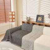 Charcoal Tweed Knit sofa throw seen from the side on a corner sofa