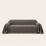 Charcoal Tweed Knit sofa throw on a plain studio background