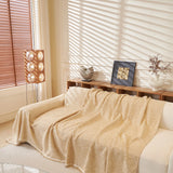 Khaki Tweed Knit sofa throw draped over a three-seater sofa in a bright living room, view 4