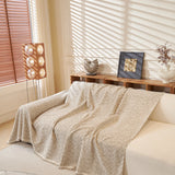 Pearl Grey Tweed Knit sofa throw draped over a three-seater sofa in a bright living room, view 3