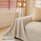 Pearl Grey Tweed Knit sofa throw styled with cushions on a low-back sofa, view 2