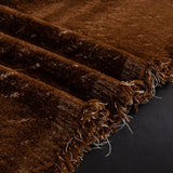 Auburn Brown Velvet Embossed sofa throw covering the arm and seat of a sectional