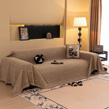 Boucle-Style Sand Velvet Embossed sofa throw draped over a three-seater sofa in a bright living room, view 4