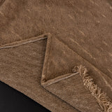 Boucle-Style Sand Velvet Embossed sofa throw photographed at an angle beside a floor lamp, view 3