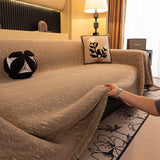 Boucle-Style Sand Velvet Embossed sofa throw spread across a sofa in daylight, view 2