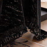 Ink Black Velvet Embossed sofa throw seen from the side on a corner sofa, view 3