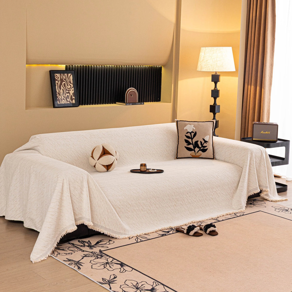 Ivory Cream Velvet Embossed sofa throw draped over a three-seater sofa in a bright living room, view 2