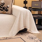 Ivory Cream Velvet Embossed sofa throw shown across the seat and backrest of a two-seater, view 2