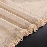 Ivory Cream Velvet Embossed sofa throw covering the arm and seat of a sectional, view 2