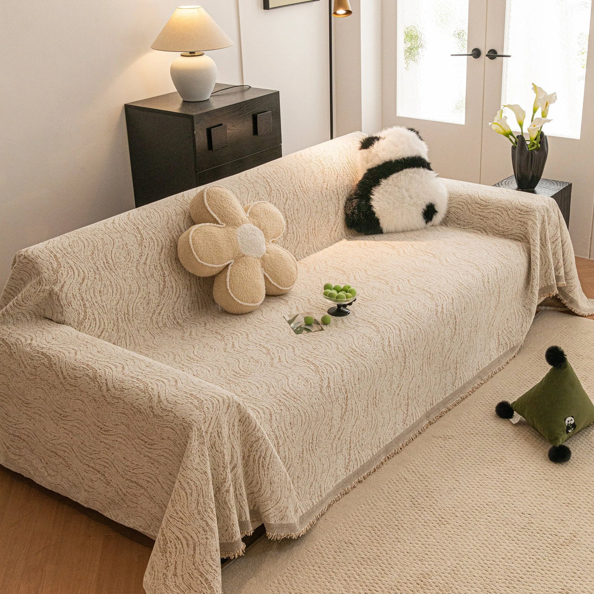Boucle-Style Sand Wave Quilted sofa throw draped over a three-seater sofa in a bright living room, view 2