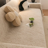 Boucle-Style Sand Wave Quilted sofa throw seen from the side on a corner sofa, view 2