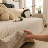 Boucle-Style Sand Wave Quilted sofa throw shown across the seat and backrest of a two-seater, view 2