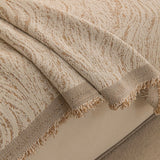 Boucle-Style Sand Wave Quilted sofa throw covering the arm and seat of a sectional, view 2