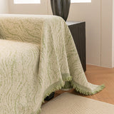Lime Mist Wave Quilted sofa throw covering the arm and seat of a sectional