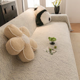 Stone Grey Wave Quilted sofa throw seen from the side on a corner sofa, view 3