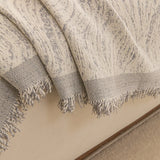 Stone Grey Wave Quilted sofa throw styled with cushions on a low-back sofa, view 3
