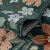 Covaba boho modern parisian floral scalloped rug in forest fern, styled in a room setting