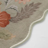 Covaba boho modern parisian floral scalloped rug in coffee brown, styled in a room setting, view 2