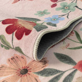Covaba boho modern parisian floral scalloped rug in soft blush, styled in a room setting