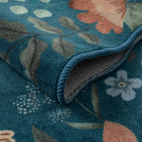 Covaba boho modern parisian floral scalloped rug in deep navy, styled in a room setting