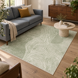 Fern green abstract terrain rug in a living room with a gray sofa, ocher cushion and a walnut sideboard