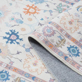 Covaba boho oushak floral rug in blush clay, styled in a room setting