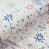 Covaba boho oushak floral rug in blush clay, styled in a room setting, view 2