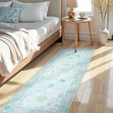 Covaba boho oushak floral runner rug in teal haze, styled in a room setting, view 2