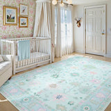 Covaba boho oushak floral area rug in teal haze, styled in a room setting, view 3
