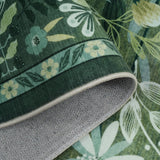 Covaba modern botanical floral rug in fern green, styled in a room setting, view 2